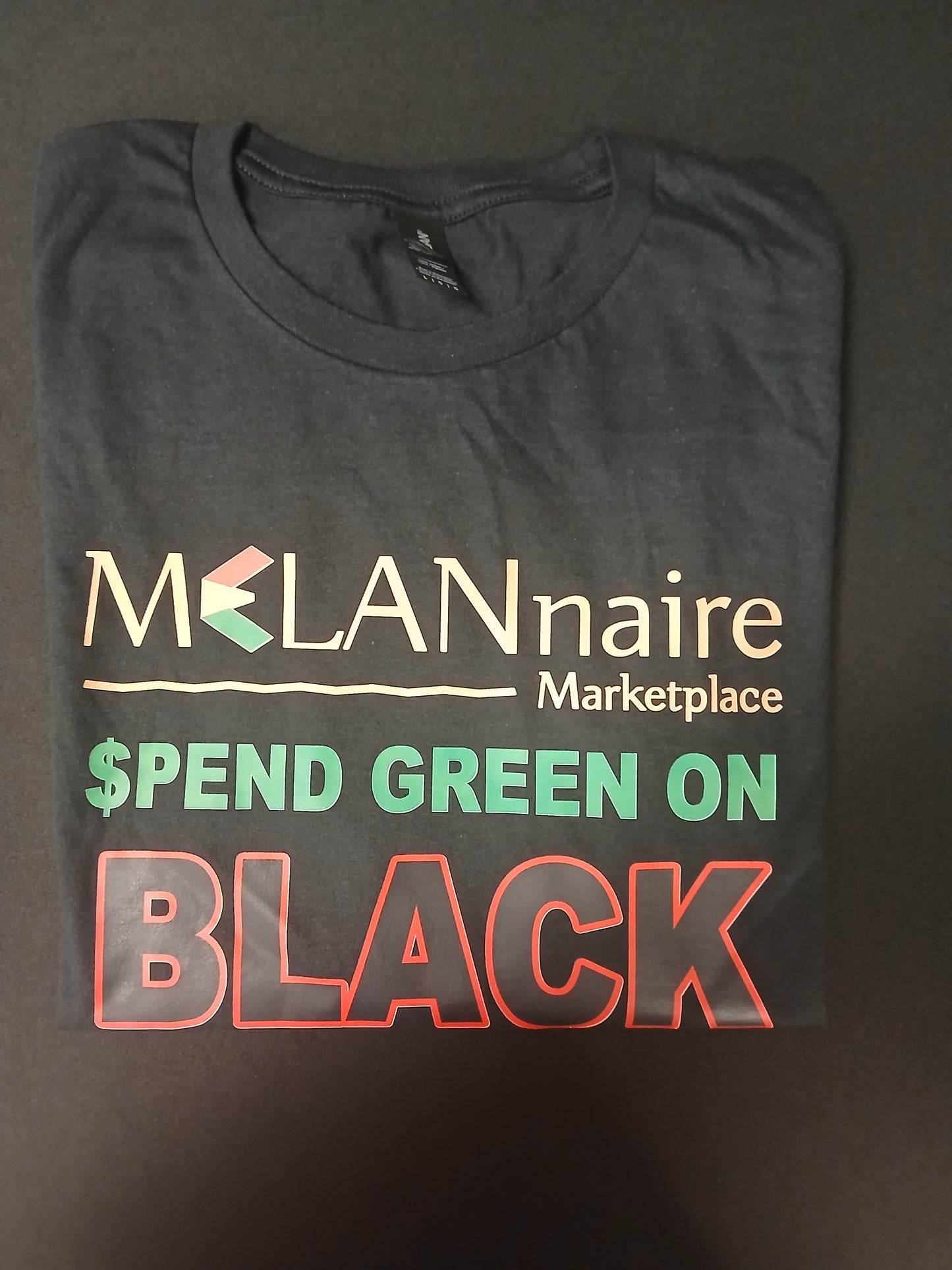 T-Shirt - MELANnaire (Spend Green On Black)